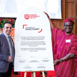Mehrshad Esfandiari (Chairperson of Belfast City of Sanctuary) and Israel Eguaogie (City of Sanctuary Coordinator) proudly pictured with the signed 'Our Path To Sanctuary' pledge.
